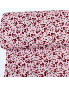 Cotton muslin (double gauze) with pattern ROSES on a light pink background 